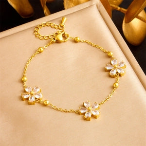 Bracelet fleurs dorées avec zircons et fermoir