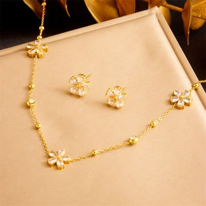 Collier et boucles d'oreilles fleur dorée avec strass